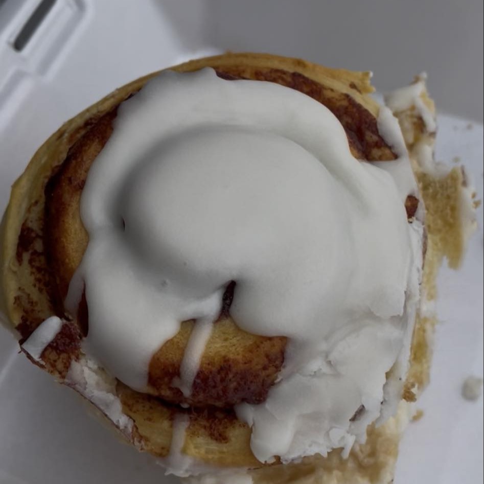 Cinnamon roll topped with icing